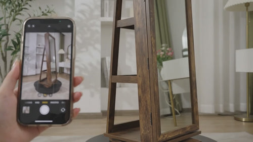Wooden freestanding mirror photographed with a smartphone in a living room